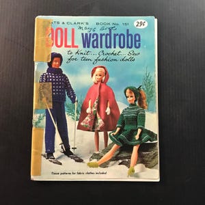 May include: Vintage "Doll Wardrobe" book cover featuring illustrations of fashion dolls in winter outfits. The cover has the text "to Knit... Crochet... Sew for teen fashion dolls". The book is from the 1960s.