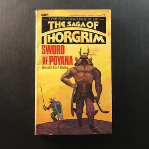 May include: Vintage paperback book cover for "The Saga of Thorgrim: Sword of Poyana" by Gerald Earl Bailey. The cover features a warrior with antlers and a sword, set against a yellow and orange background. A smaller illustration shows another warrior.