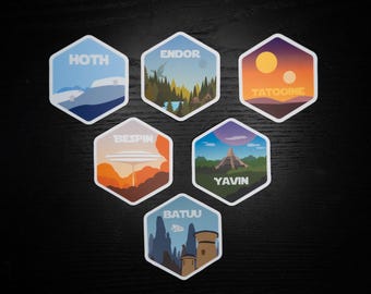 May include: Six hexagonal stickers with illustrations of different planets from Star Wars. The stickers feature the names "Hoth", "Endor", "Tatooine", "Bespin", "Yavin", and "Batuu".