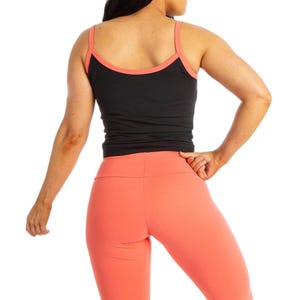 May include: A white ceramic mug with a black handle and the text "But First, Coffee" in a handwritten style. The mug is on a white surface. The mug is 4 inches tall.