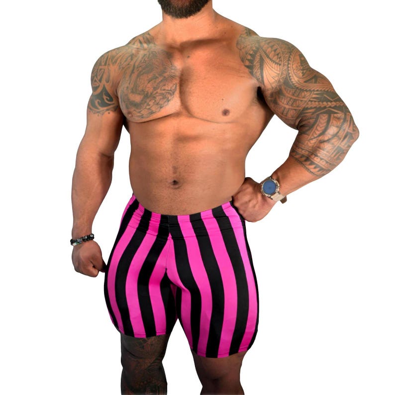 May include: Pink and black striped shorts. The shorts are vertically striped with alternating bands of bright pink and black. The shorts are form-fitting and appear to be made of a stretchy material.