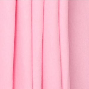 May include: Close-up of a soft, pink fabric with vertical folds. The fabric has a smooth, even texture.