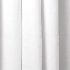 May include: White fabric with a smooth texture and a subtle sheen. The fabric is folded in pleats, creating a series of vertical lines.