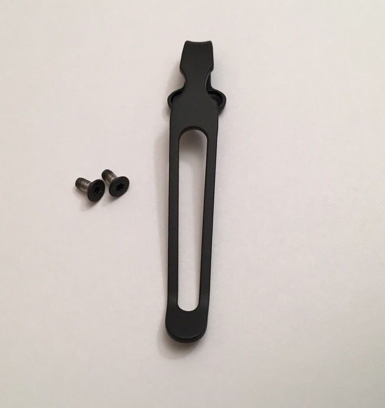 May include: Black metal pocket clip with two small screws.