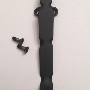 May include: Black metal pocket clip with two small black screws.
