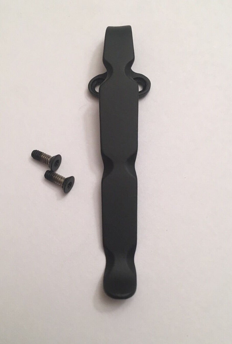 May include: Black metal pocket clip with two small black screws.