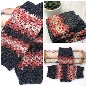 May include: A pair of crocheted leg warmers in a multi-colored yarn with stripes of dark gray, pink, and beige. The leg warmers are folded and displayed on a wooden surface.