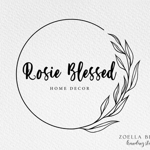 May include: Black and white logo design with a circle and a leafy branch. The text "Rosie Blessed" is inside the circle, with the words "Home Decor" below it. The text "Zoella Bloom Branding Studio" is at the bottom of the image.