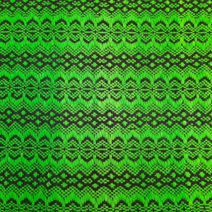 May include: Green and black fabric with a repeating geometric pattern. The pattern is made up of small circles and diamonds.