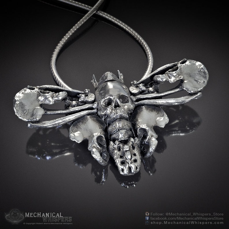 Deaths Head Hawkmoth pendant, highly detailed, designed from a 3D scan of an actual human skull and individual bones. Available in 3 metals: blackened steel, brass with a custom patina, and sterling silver with custom patina. 47mm width.