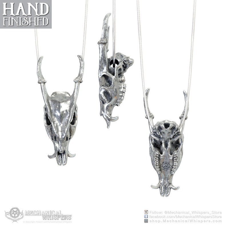 Muntjac deer skull pendant, highly detailed, designed from a 3D scan of an actual muntjac skull. Available in 3 metals: blackened steel, brass with a custom patina, and sterling silver with custom patina. 50mm tall.