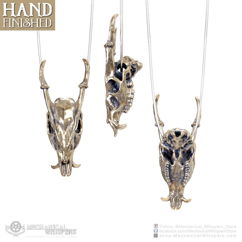 Muntjac deer skull pendant, highly detailed, designed from a 3D scan of an actual muntjac skull. Available in 3 metals: blackened steel, brass with a custom patina, and sterling silver with custom patina. 50mm tall.