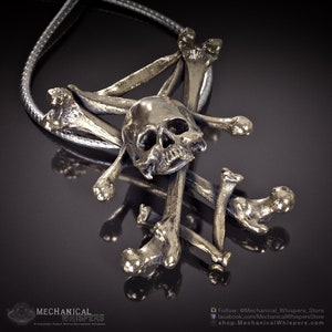 Lucifer Sigil pendant, highly detailed, designed from a 3D scan of an actual human skull and individual bones. Available in 3 metals: blackened steel, brass with a custom patina, and sterling silver with custom patina. 32mm tall.