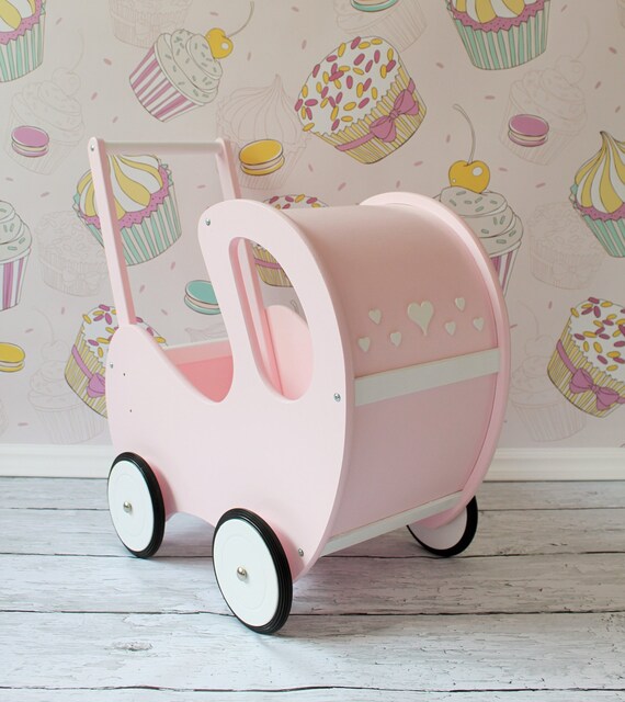 pink wooden dolls pram