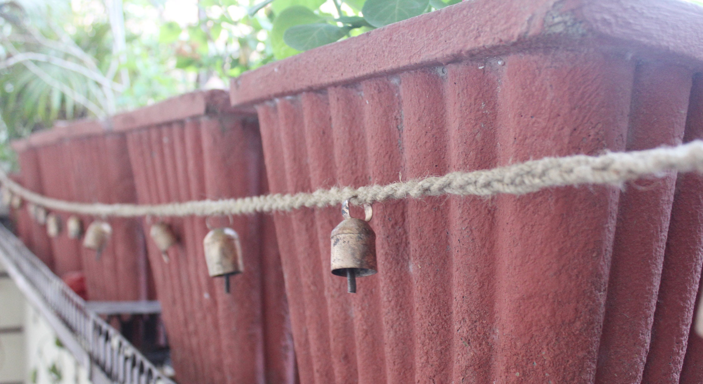 thumbnail interactive-video image 1 of Handmade Rustic String Of 5 Black Cowbells – Hanging Garden Decoration (85cm) 1 of 2