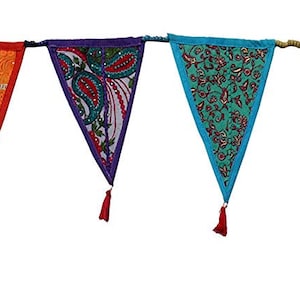 May include: A string of ten colorful triangular fabric flags with tassels. Each flag has a different pattern and design. The flags are connected by a string and are hanging from a white background.