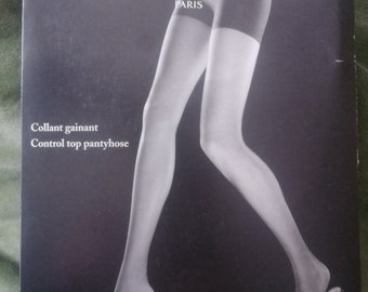 May include: Black and white image of Chantal Thomass control top pantyhose packaging. The packaging features a stylized illustration of a woman's legs in sheer pantyhose, with the brand name and "Paris" prominently displayed.