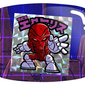 May include: A holographic sticker featuring a red robot character with white accents and Japanese text. The robot has a stylized design with a cross on its head and is set against a purple and blue background.