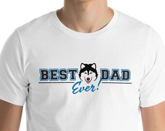 May include: White t-shirt with a blue and black graphic that says "Best Dad Ever!" with a cartoon husky dog wearing a blue collar.