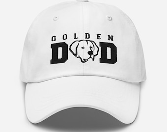 May include: White baseball cap with black embroidered text that reads "Golden Dod" with a silhouette of a golden retriever dog's head in the middle of the word "Dod".