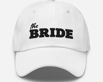 The Bride Hat white with high quality black embroidery to compliment The Groom Hat. Adjustable brass buckle strap and Wedding shower gift.