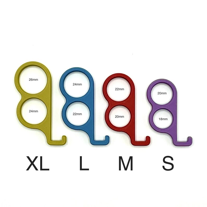 May include: Four colored metal finger ring sizers in yellow, blue, red, and purple. Each sizer has two circular openings with measurements in millimeters. The sizes are labeled XL, L, M, and S.