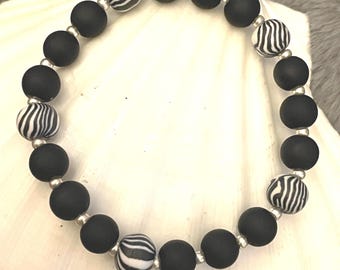 Agate and zebra striped beads stretch bracelet with silver accents