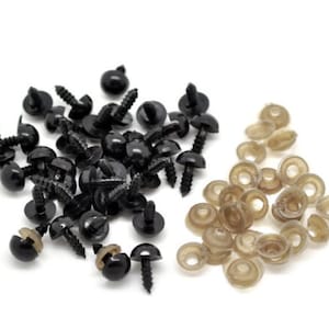 May include: A set of black plastic safety eyes with screw backs and a set of brown plastic washers. The safety eyes are commonly used for craft projects like stuffed animals.
