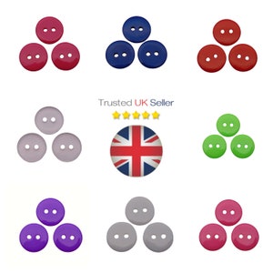 May include: Assortment of 30 round plastic buttons in various colours, including red, blue, green, purple, and grey. Each button has two holes.