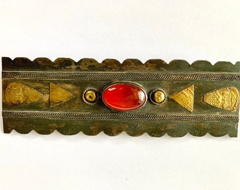Rectangular brass Middle Eastern pin with scarab-style orange stone