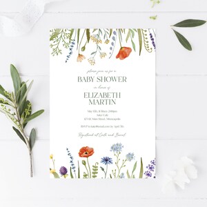 May include: A floral baby shower invitation with a watercolor design featuring blue, purple, and orange flowers. The invitation includes the text "Please join us for a Baby Shower in honor of Elizabeth Martin" with the date, time, and location of the event.