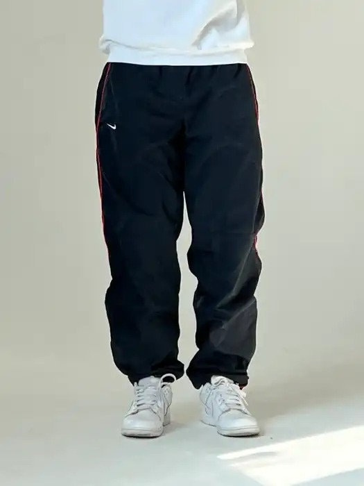 Y2k Nike track pants, Men's Fashion, Bottoms, Joggers on Carousell