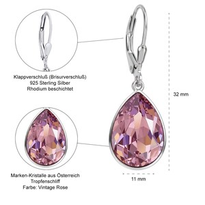 May include: Silver teardrop earrings with a vintage rose-colored crystal. The earrings are 32 mm long and 11 mm wide. The text on the image says: 925 Sterling Silver, Rhodium coated, and Marken-Kristalle aus &Ouml;sterreich.