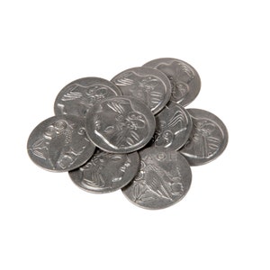 May include: A pile of silver-colored coins with an owl design on one side and a person's head on the other side.