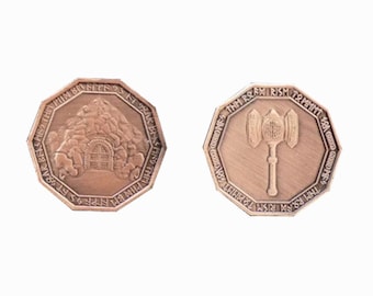 May include: Two-sided metal coin with an octagonal shape. One side features a depiction of a small house with a door and a mountain behind it. The other side features a hammer with a long handle. Both sides have text in an ancient language.