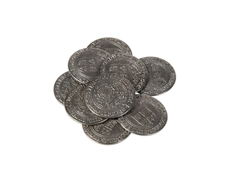 May include: A pile of silver coins with intricate designs and lettering. The coins are arranged in a circular pattern, with the edges of the coins overlapping.
