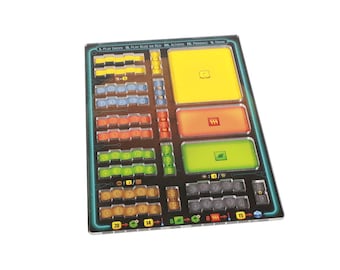 May include: A clear acrylic game organizer with compartments for game pieces. The organizer has a black background with green, yellow, red, and blue accents. The text "PL. PLAY GREEN", "PL. PLAY BLUE OR RED", "PL. ACTIONS", "PL. PRODUCE", and "PL. DRAW" is printed on the organizer.