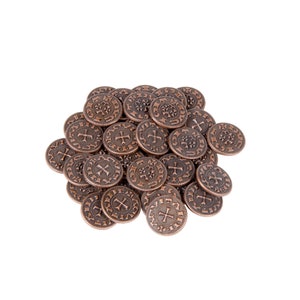 May include: A pile of copper-colored metal coins with a cross design and lettering on each side.