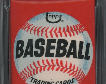 May include: A red, white, and blue 1974 Topps Baseball Wax Pack with a baseball graphic and the text "ALL 660 CARDS IN ONE SERIES!"