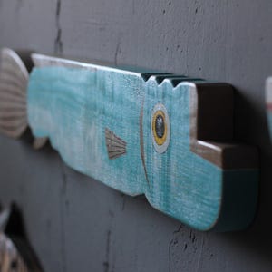 Arte murale di pesce di legno