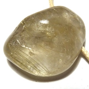 Rutilated quartz, rutilated quartz pendant, rutilated quartz on a chain