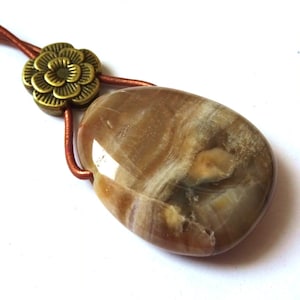 petrified wood, hole stone pendant with leather strap