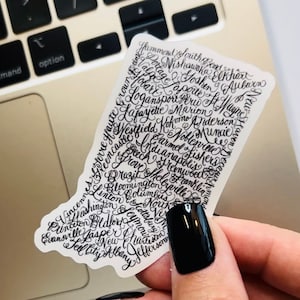 May include: A clear sticker with a boot shape outline. The boot is filled with the names of cities and towns in Indiana, written in black cursive script.