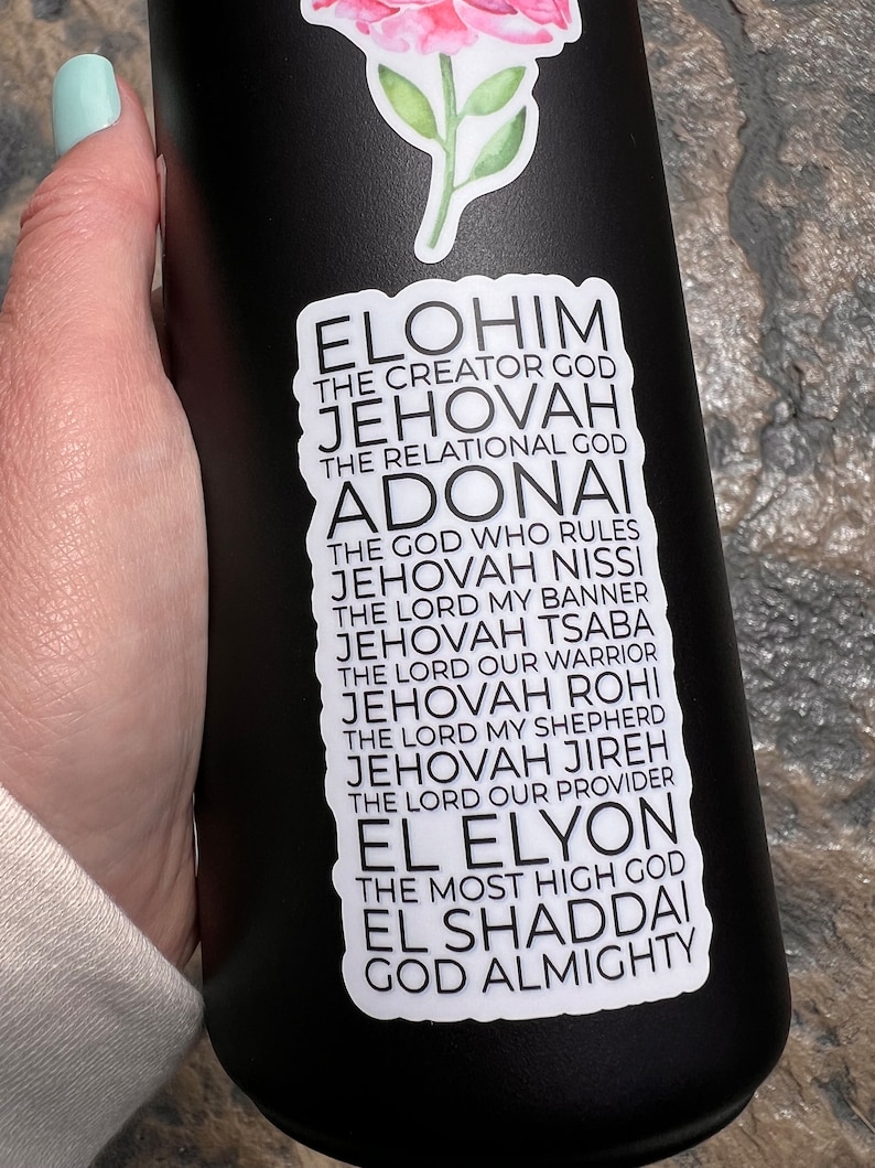 May include: A black water bottle with a white sticker featuring a list of names for God in Hebrew and English. The sticker includes the words "Elohim", "Jehovah", "Adonai", "El Elyon", and "El Shaddai".