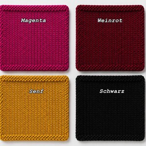 May include: Four square knitted coasters arranged in a grid. The top left is magenta with the text Magenta. The top right is dark red with the text Weinrot. The bottom left is mustard yellow with the text Senf. The bottom right is black with the text Schwarz.