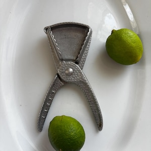 May include: A handmade wooden sign with the text "Welcome" in a playful font. The sign features a distressed white background and a dark stained wooden frame, perfect for a front door or entryway.