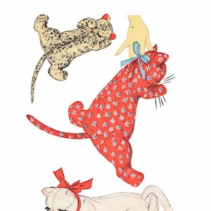 May include: Vintage sewing pattern featuring three cat-shaped stuffed toys. The cats are in various poses and made from patterned fabrics, including a spotted beige, a red floral, and a cream-colored fabric. The pattern is labeled "ADVANCE 6931".