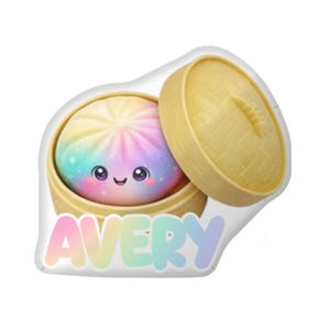 May include: Avery-branded, cartoon-style dumpling toy with a rainbow-colored filling and a smiling face. The dumpling sits in an open, yellow bamboo steamer. The name "Avery" is written in pastel colors below.