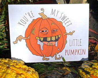 May include: A greeting card with a cartoon pumpkin illustration. The orange pumpkin has a goofy expression and the text reads "You're My Sweet Little Pumpkin" in a handwritten style. The card is on a white background.