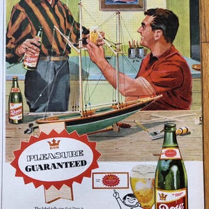 May include: A vintage advertisement for Dow Ale beer featuring two men building a model sailboat. The ad copy reads "Dow Pleasure Guaranteed" and "Happy the day you change to Dow, the guaranteed beer".